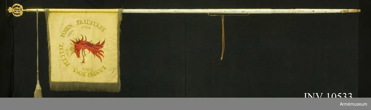 Grupp B.

Samhörande: spets Oscar II, spetsskoningen märkt G. Nyström, kordong, guldfärgad. Spetsens bredd 115 mm.