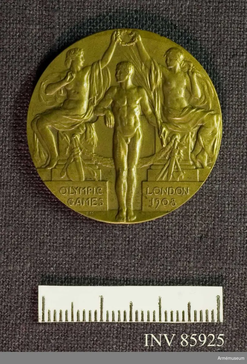 Grupp M II.
Bronsmedalj vunnen av Oscar Gomer Swahn i löpande hjort, dubbelskott, OS 1908 i London.