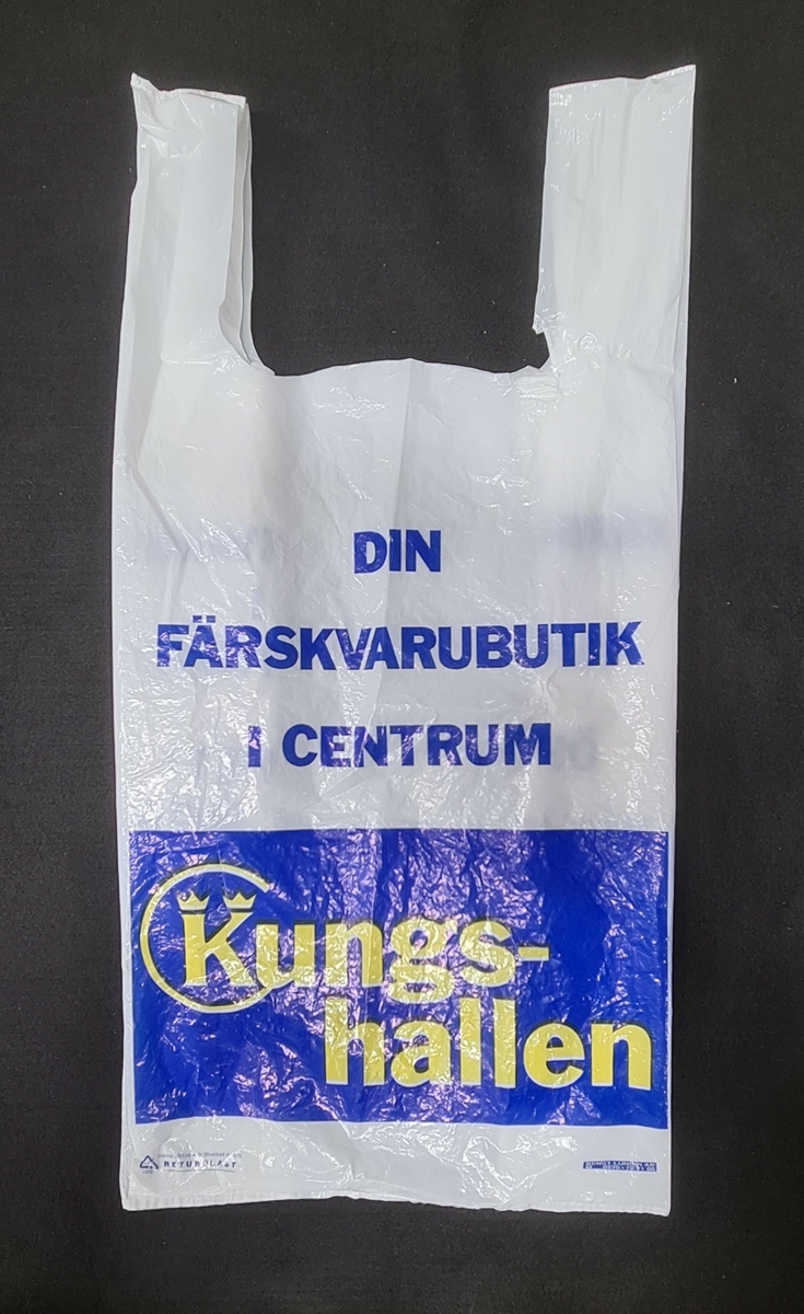 Plastkasse, vit, med logga från Kungshallen i Trollhättan. 

På kassen står:
Din färskvarubutik
i centrum
Kungshallen