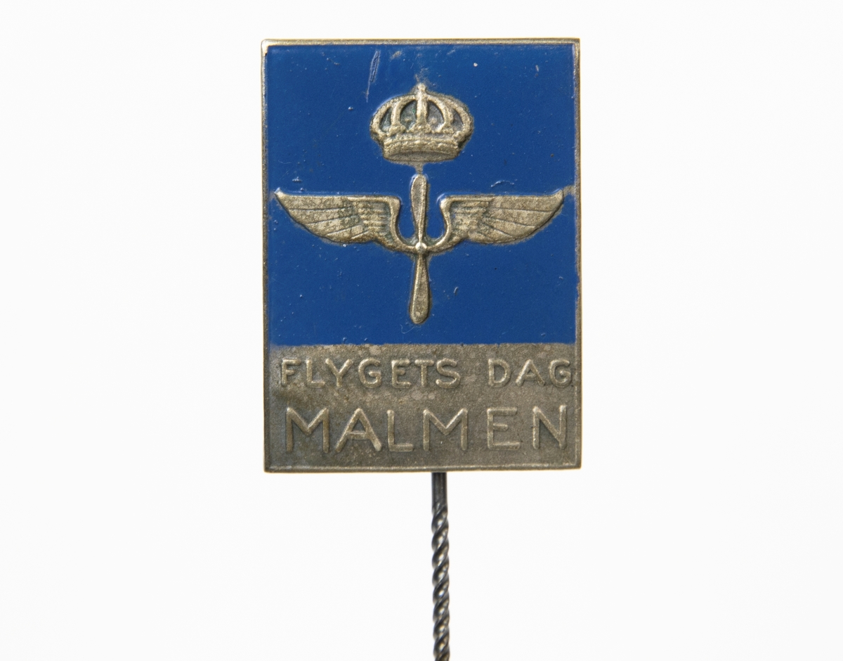 Rockslagsnål med flygvapenemblem på blå botten och texten Flygets dag Malmen.