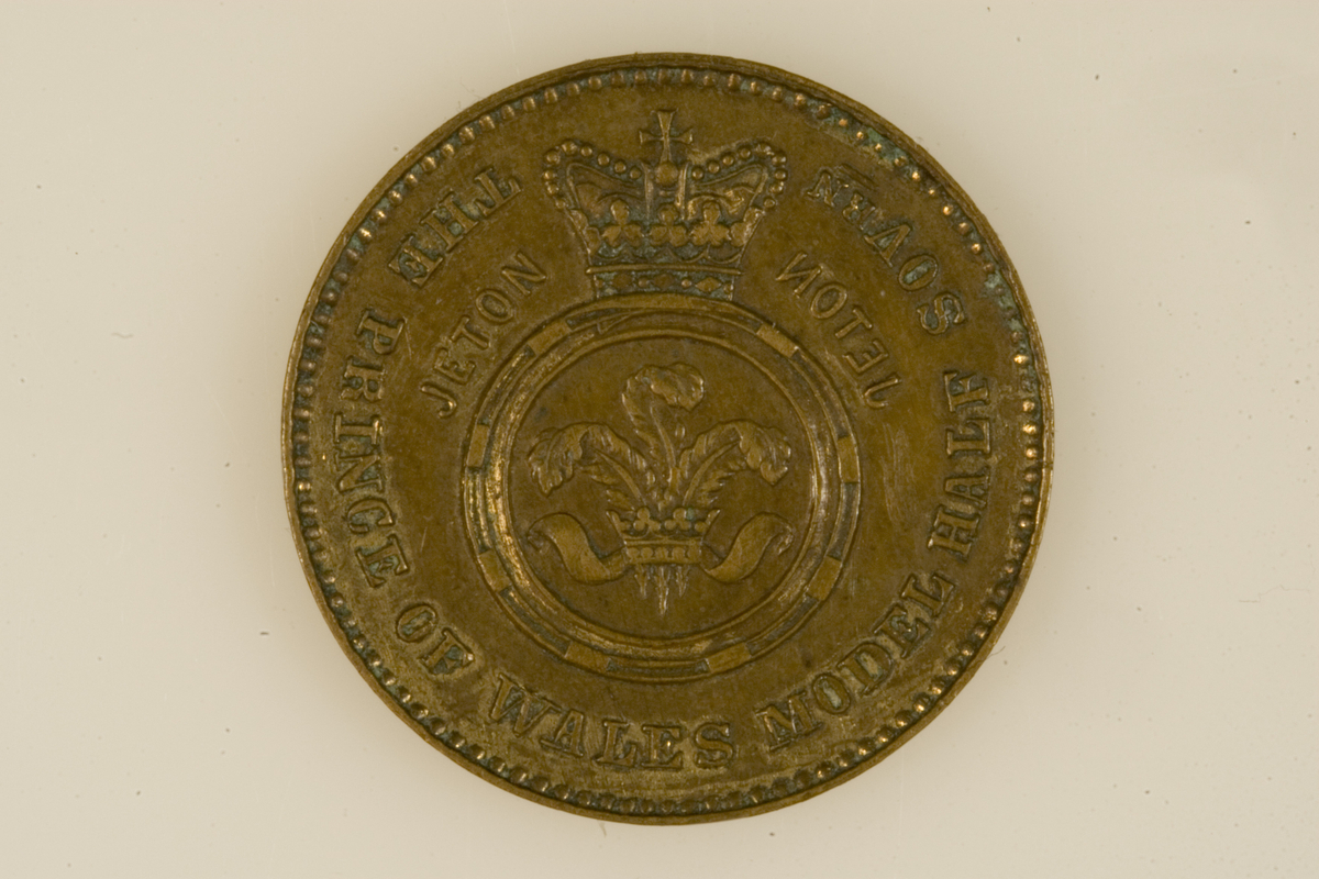 Motiv advers: Dronning Victoria av Storbritannia i profil mot venstre.

Motiv revers: Kronet bånd i sirkel med prinsen av Wales badge. På hver side ordet JETON, henholdsvis rettvendt og speilvendt.
