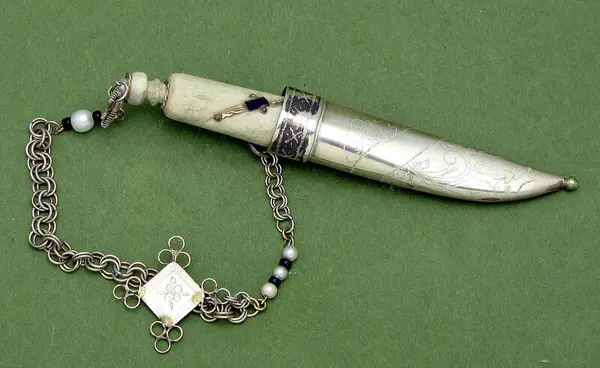 Small chained tobacco knife in bone and silver made with  by Olav Stålenblad Tollefsen.