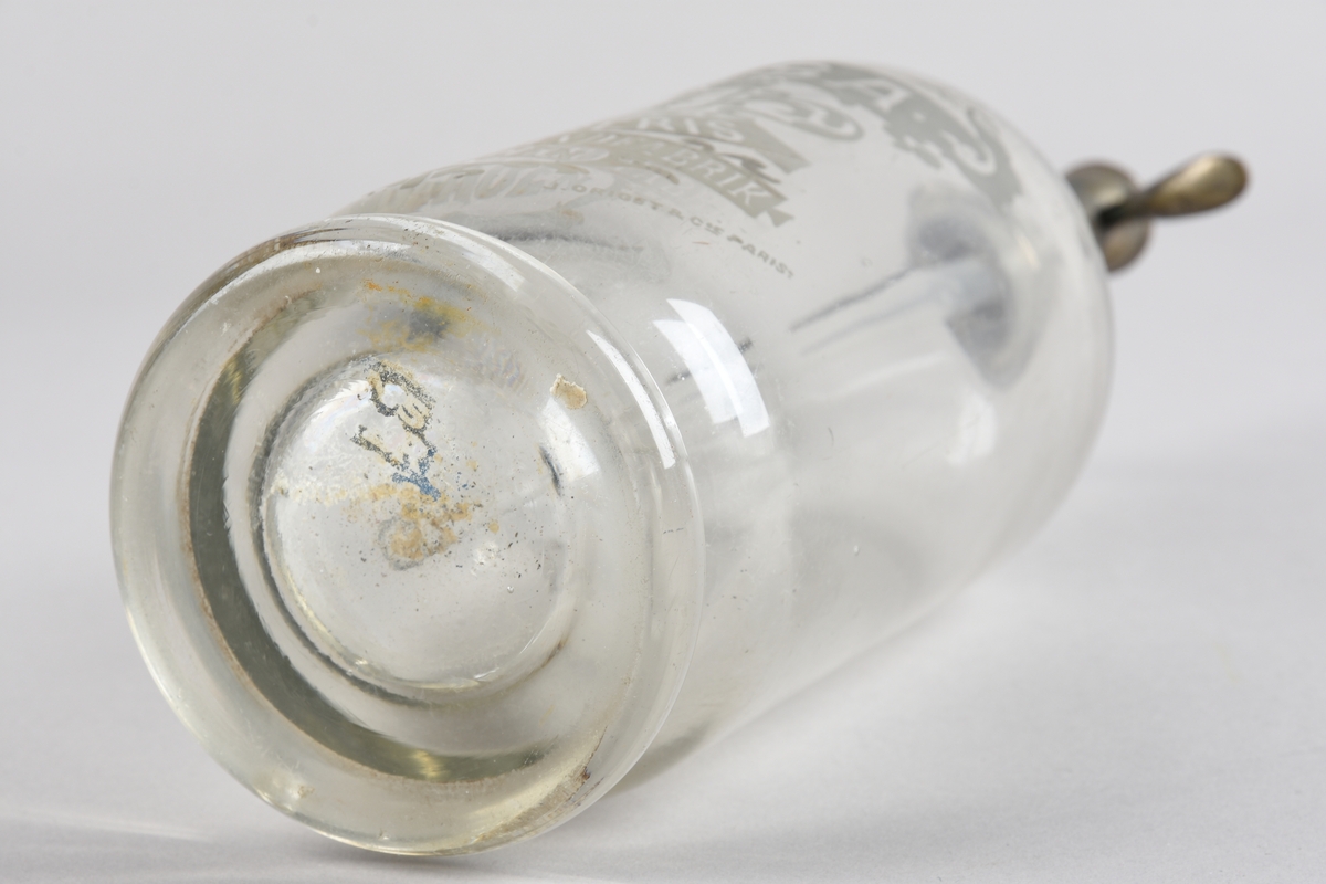 Ølflaske av glas med metalltopp for skjenking. Frå Hansa Bryggerier.