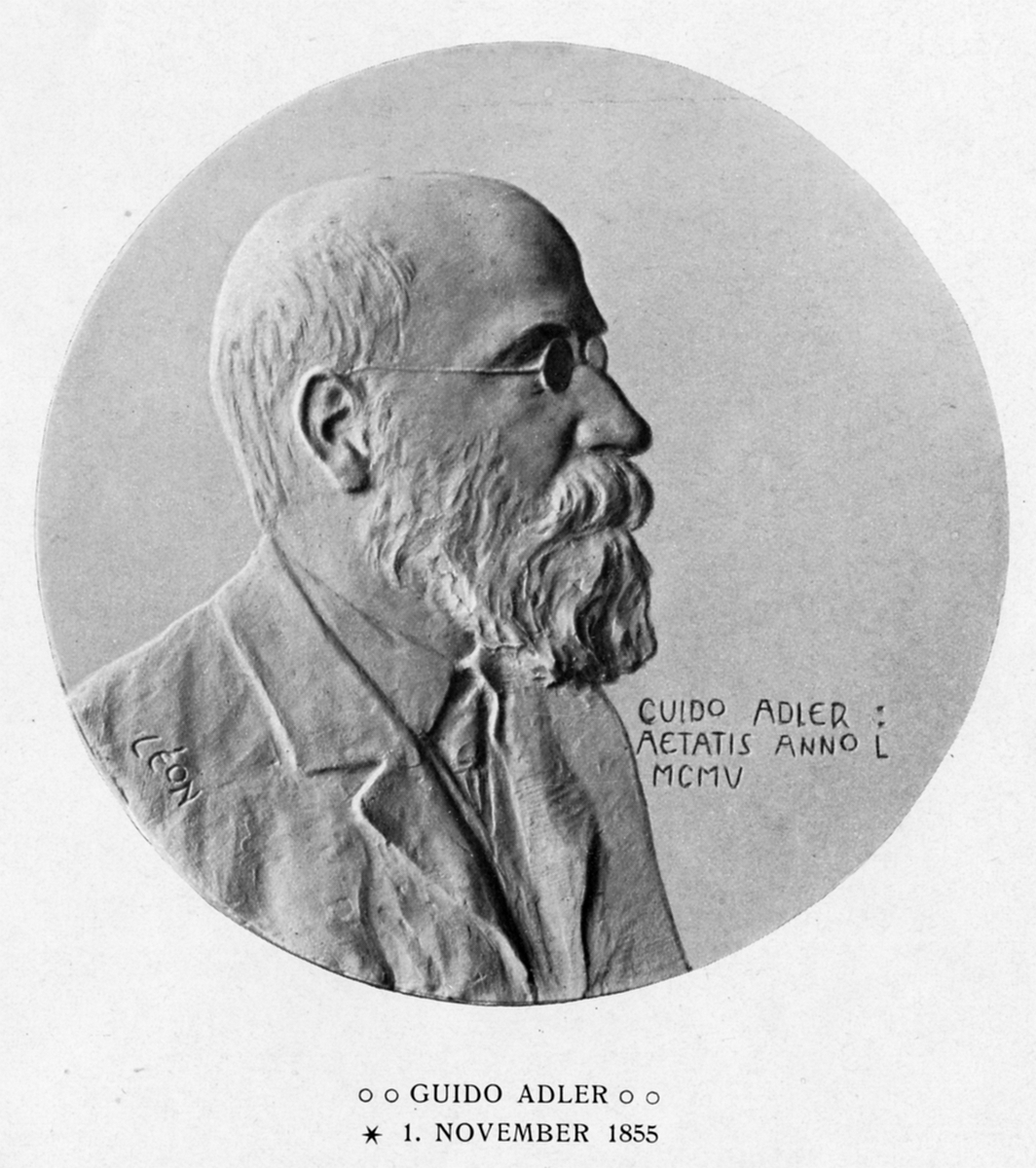 Portrett, foto av medaljong som viser Guido Adler.