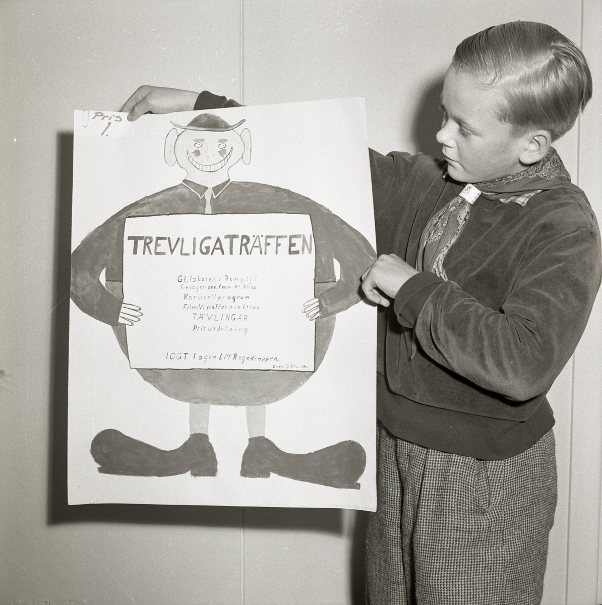 Hildings son håller i en plansch med rolig figur på den 29 oktober 1957.