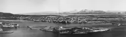 Bodø by og havn sett fra Hjertøya. Børvasstindene i bakgrunn