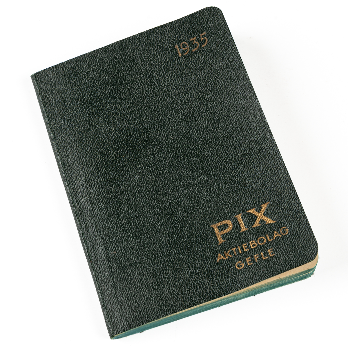 Almanacka, från 1935. Grön med guldtryck på pärmen "1935 PIX AKTIEBOLAG GEFLE".