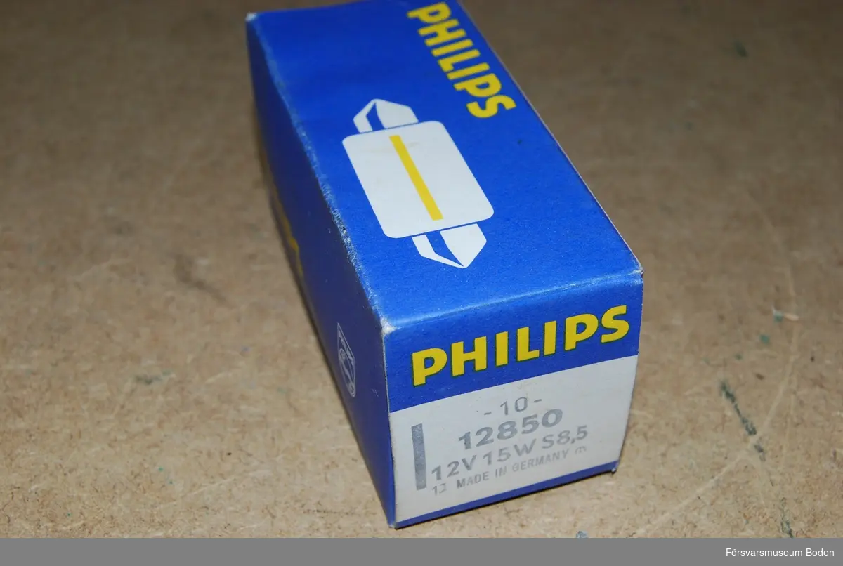 Oöppnad förpackning med 10 st glödlampor av spoltyp. Philips artikelnummer 12850. Civilförsvarsmateriel från Televerket.