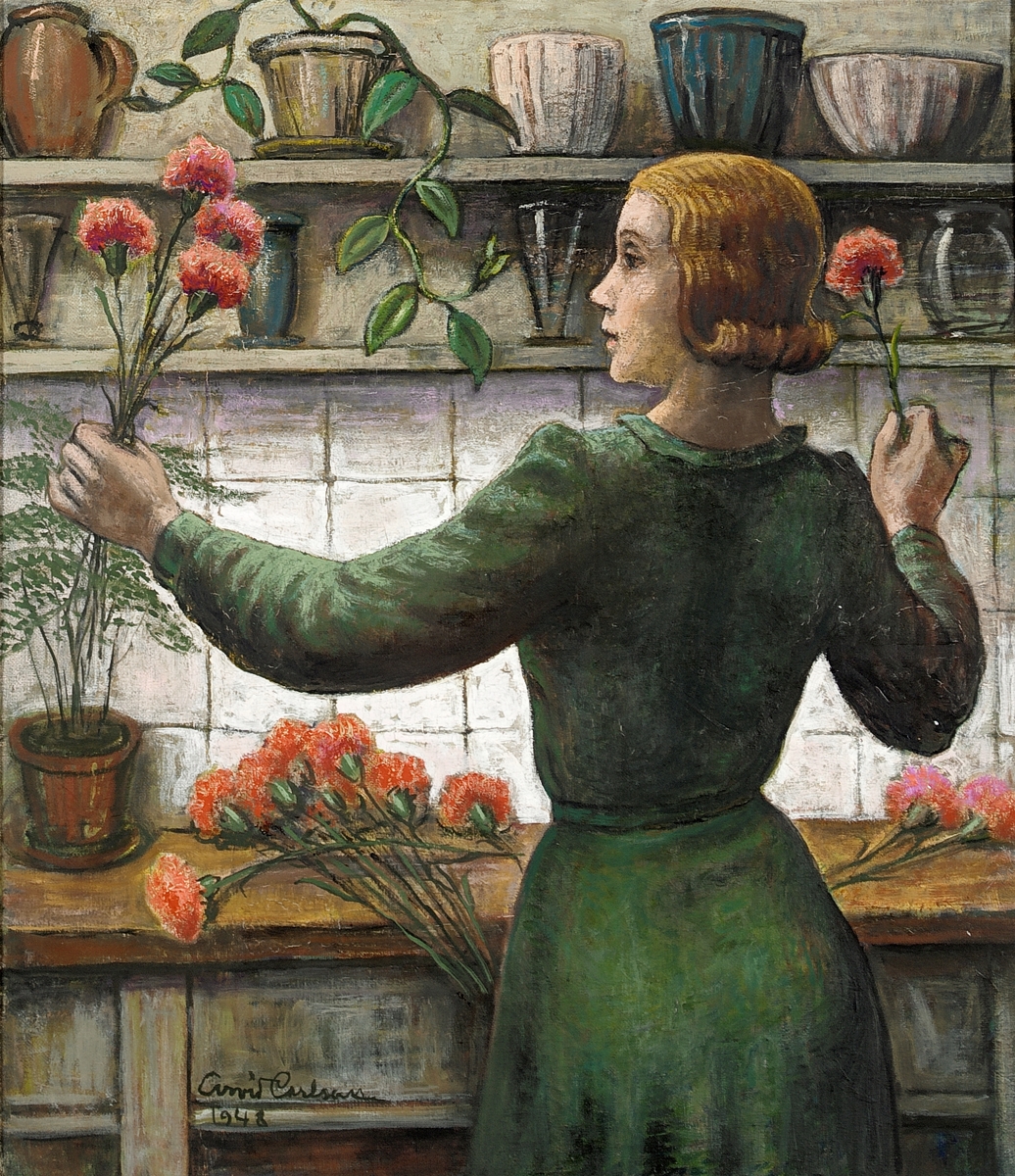 Kvinna arrangerar blommor