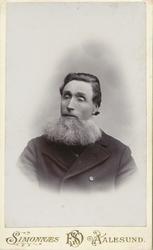 Portrettfotografi av Peder Madson Kvien, eller Kvie-Pe som h