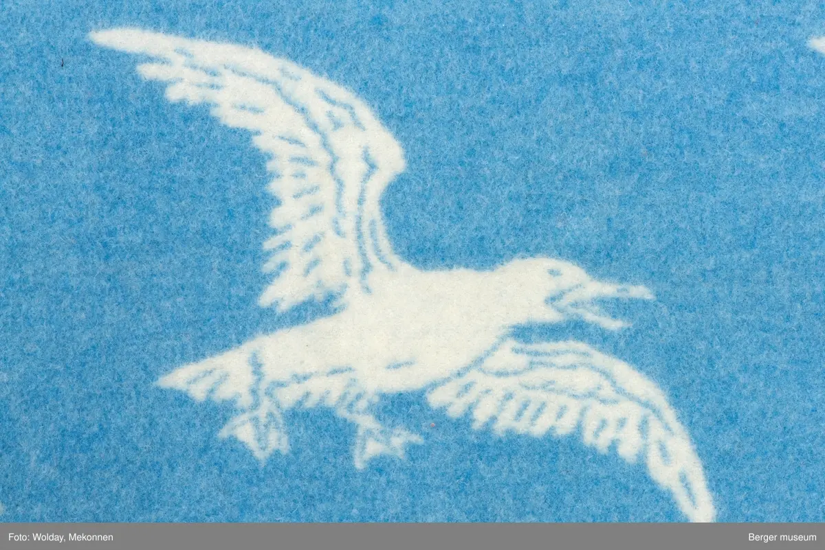 Pledd med måkemotiv