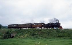 Damplokomotiv type 21e nr. 207 med ekstratog ved Ilseng i an