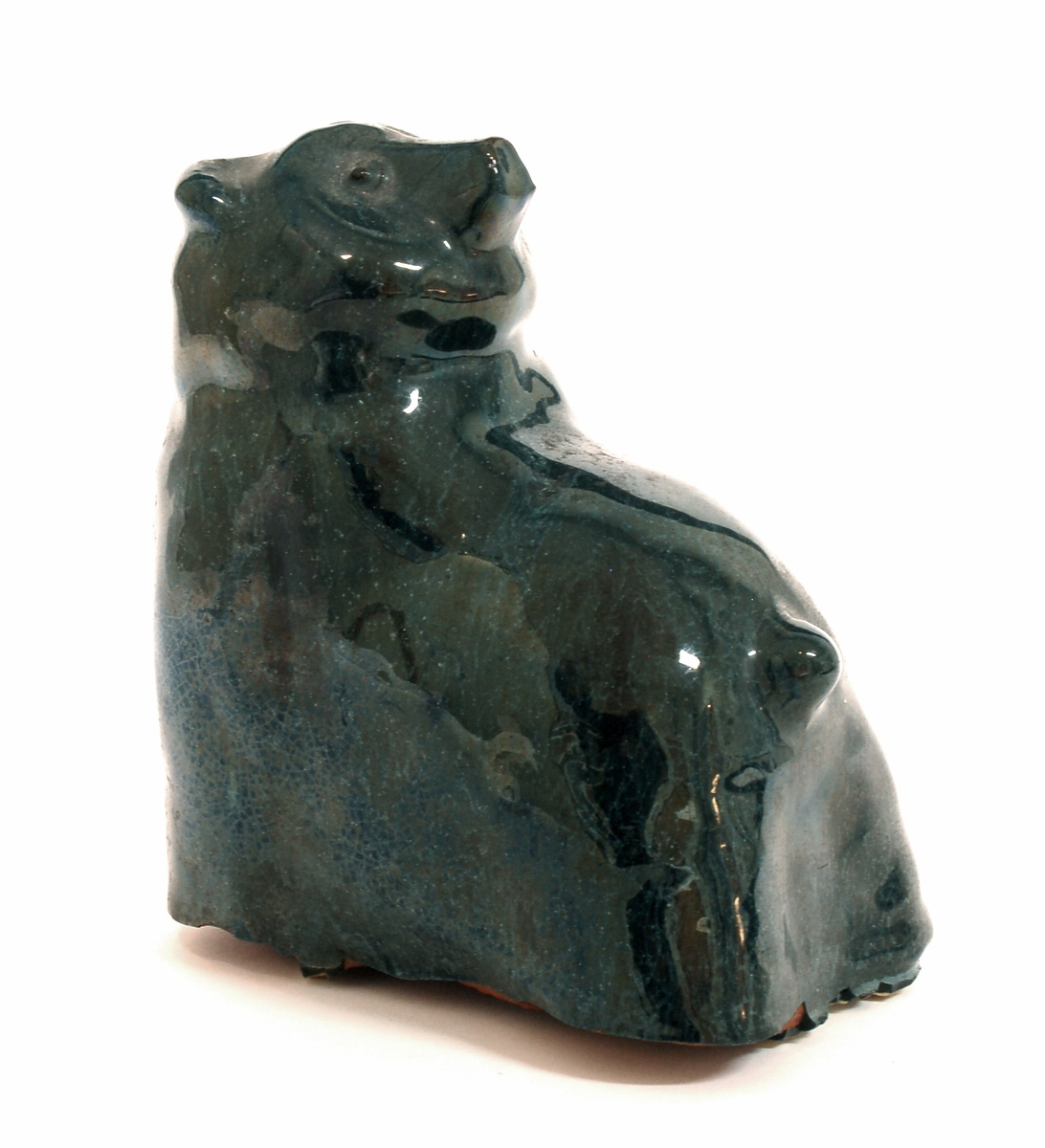 Bokstöd i form av en sittande björn, blå glasyr, lergods, formgiven av Märta Willborg, 1930-talet.