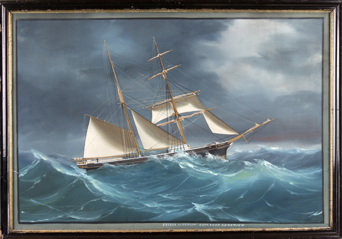 Skipsportrett av skonnertbrigg ERIKKA med delvis revet seil på opprørt hav. Ser en del av mannskapet i arbeid på dekk.