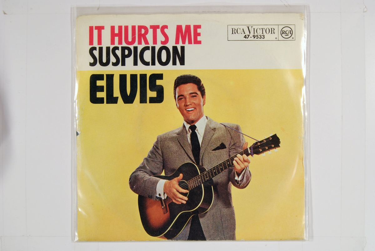 Elvis med en gitar.