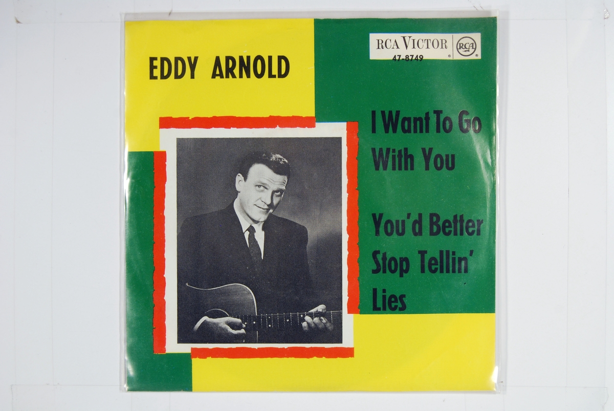 Bilde av Eddy Arnold med en gitar.