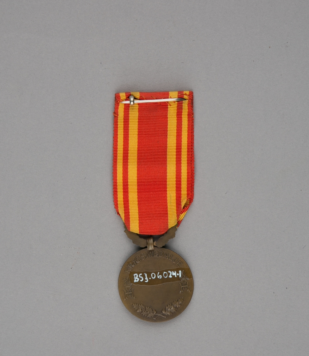 Medalje med relieff av Kong Haakon VII i profil