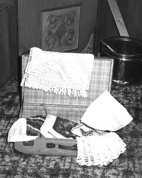 Suitcase with tablecloths and crocheting the Romani/Traveler women sold
