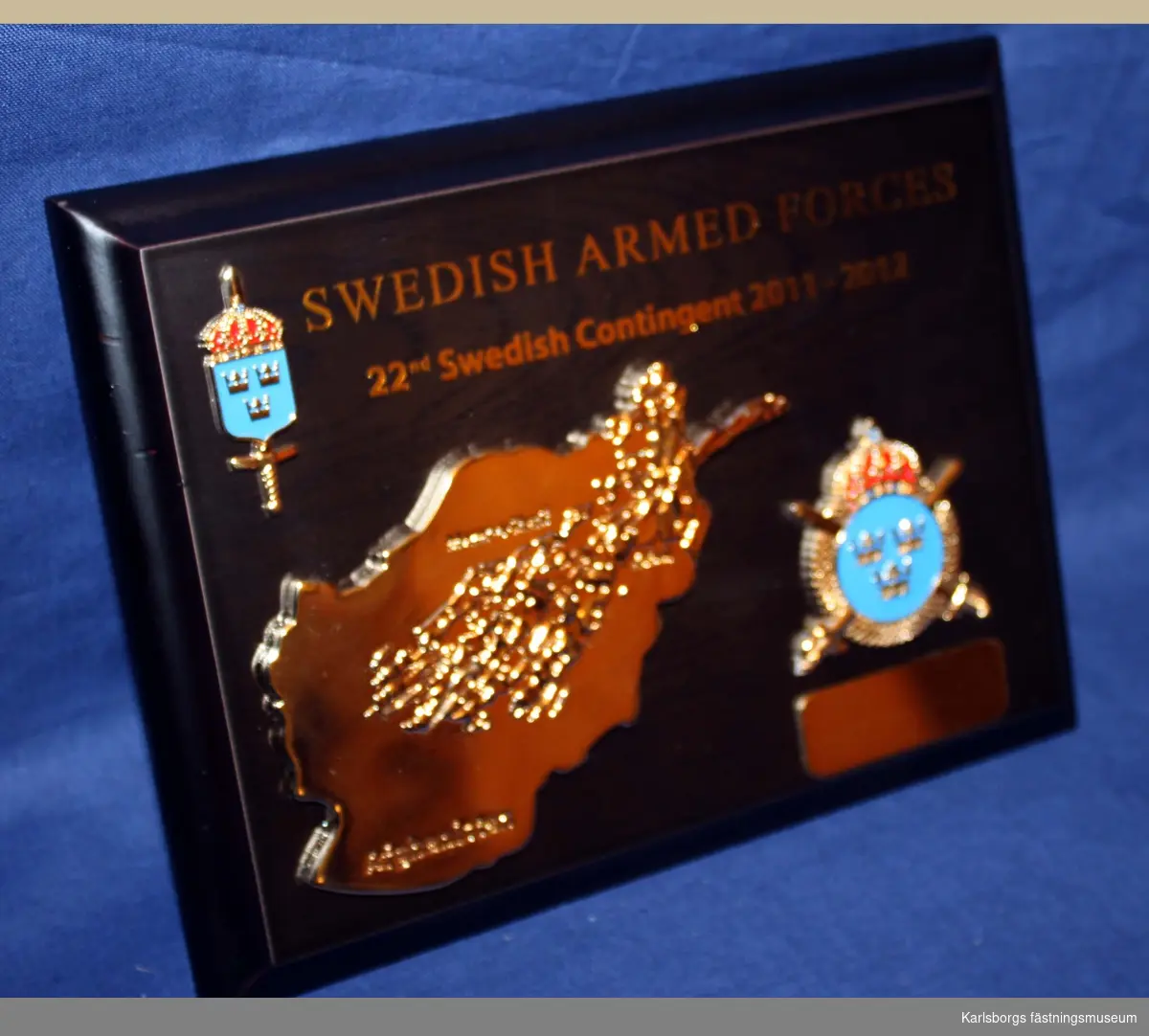 Plakett med karta över Afghanistan och K3 vapenmärke Text Swedish armed forces 22 nd Swedish contingent 2011-2012