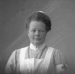 Portrett, kvinne i sykepleieruniform. Frøken Krefting.