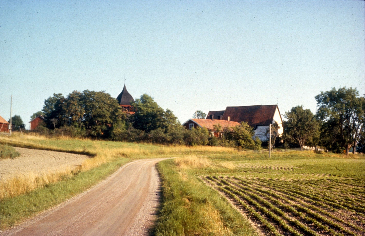 Landskapsvy med Haga kyrka, Haga socken, Uppland 1958
