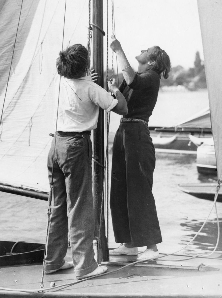 Norfolk Yachting Week. The Royal Norfolk and Suffolk Yacht Club's Races on the Oulton Broad, near Lowestoft, Suffolk. 508899.- Miss Brenda Dawson, after a hard race.