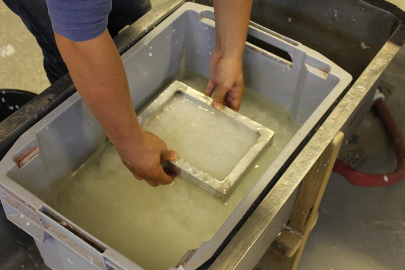 Mold is dipped into paper pulp