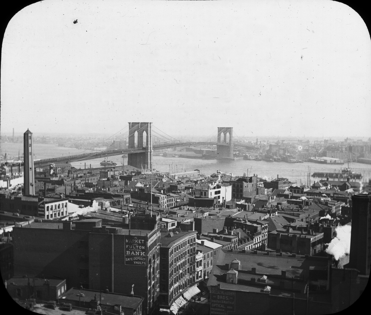 Skioptikonbild. Vy över Brooklyn Bridge och East River.