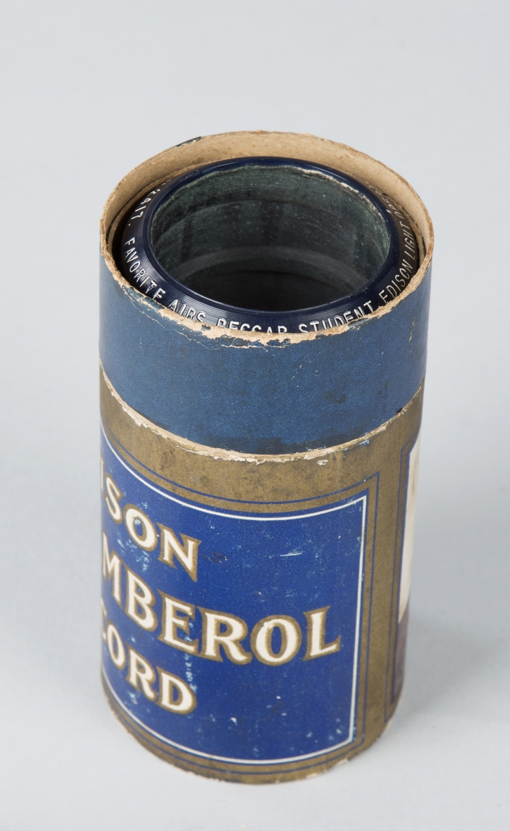 Voksrull for fonograf, med tilhørende blå- og gullmalt pappbeholder.