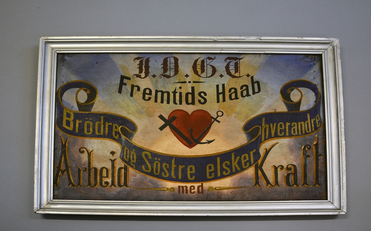 Avholdslosjens emblem, med symbolen hjerte, kors og anker.