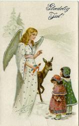 Julekort. Jule-og nyttårshilsen. En engel snakker med to små