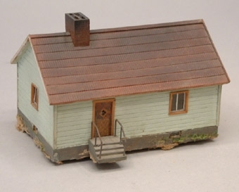 Modell i skala 1:87 av envånings bostadshus.