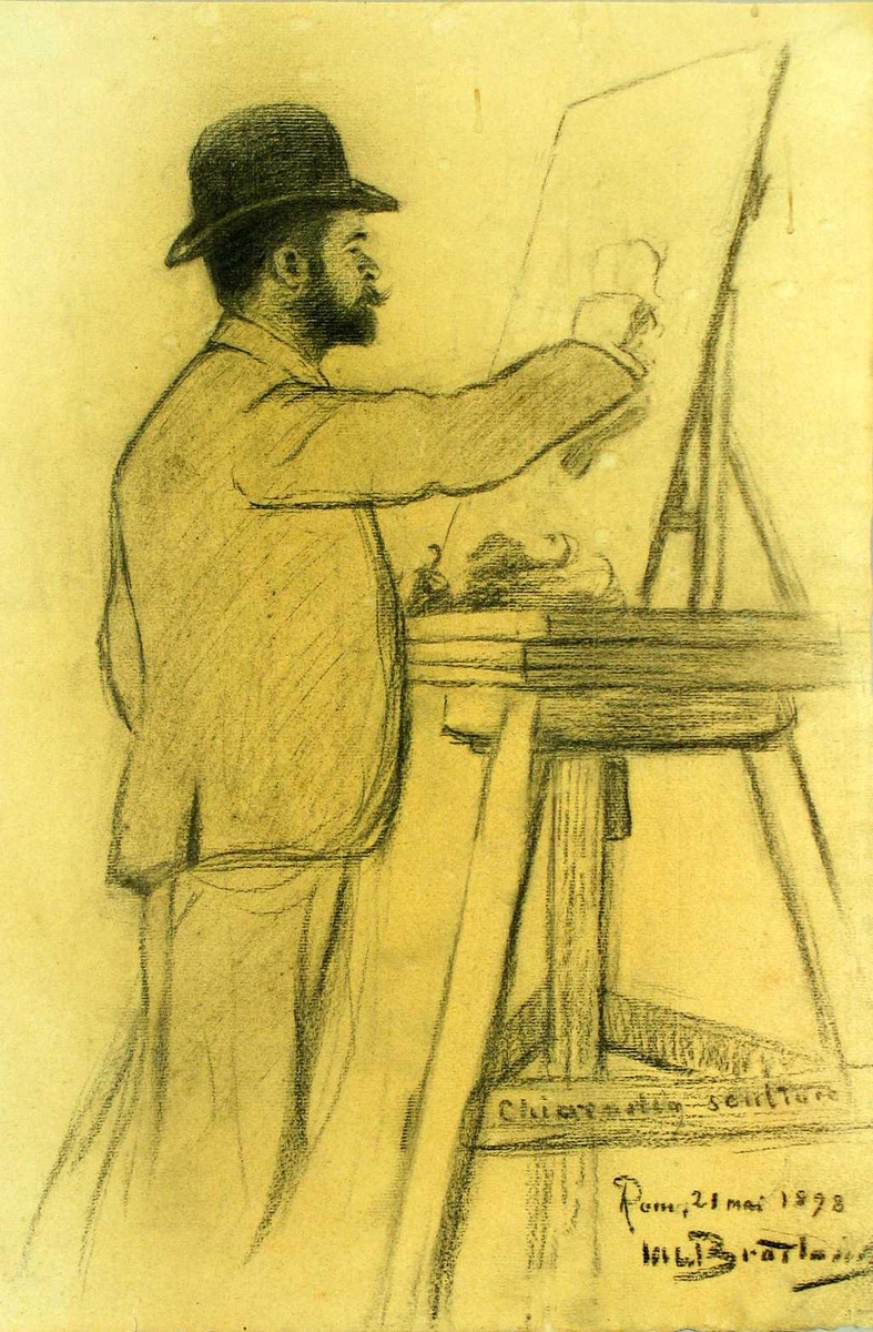 Ung mann med hatt står ved staffeliet og tegner.