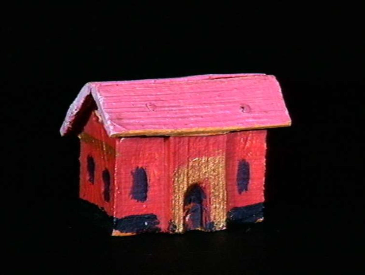 Sett med ca 200 leketøyhus laget av tre i forskjellige former og farger.